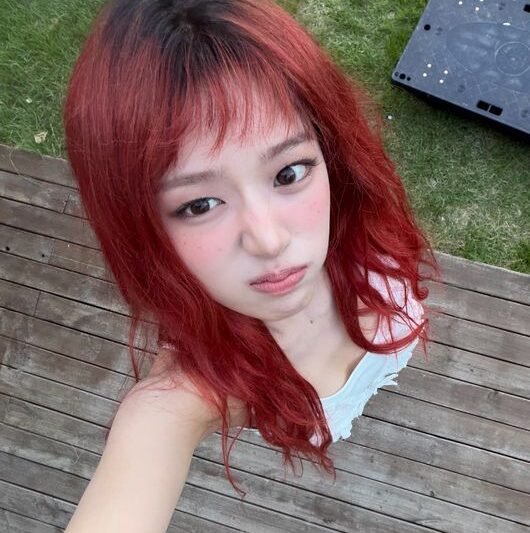 IVE An Yujin Debuts Stunning Red Hair Transformation in New Photos